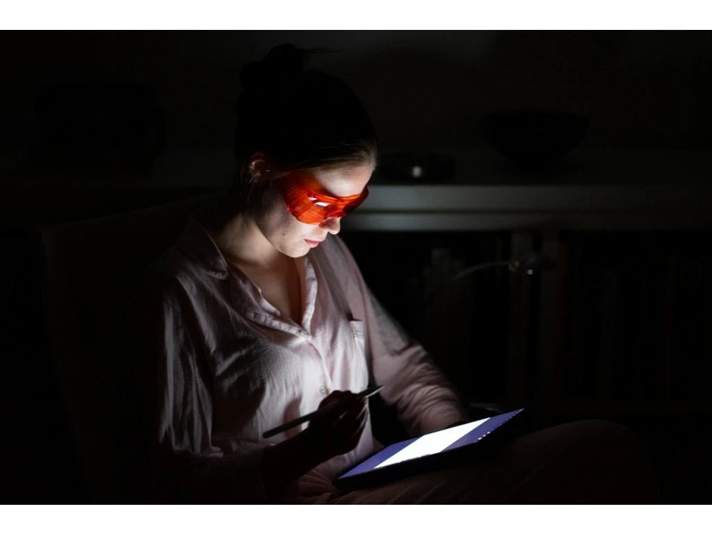 Red glasses against blue and green light - LifeUnlocked